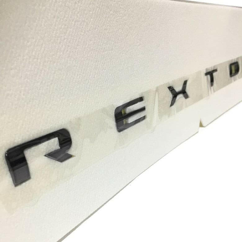 Genuine Ssangyong Rear 'REXTON' Badge (Black Edition).