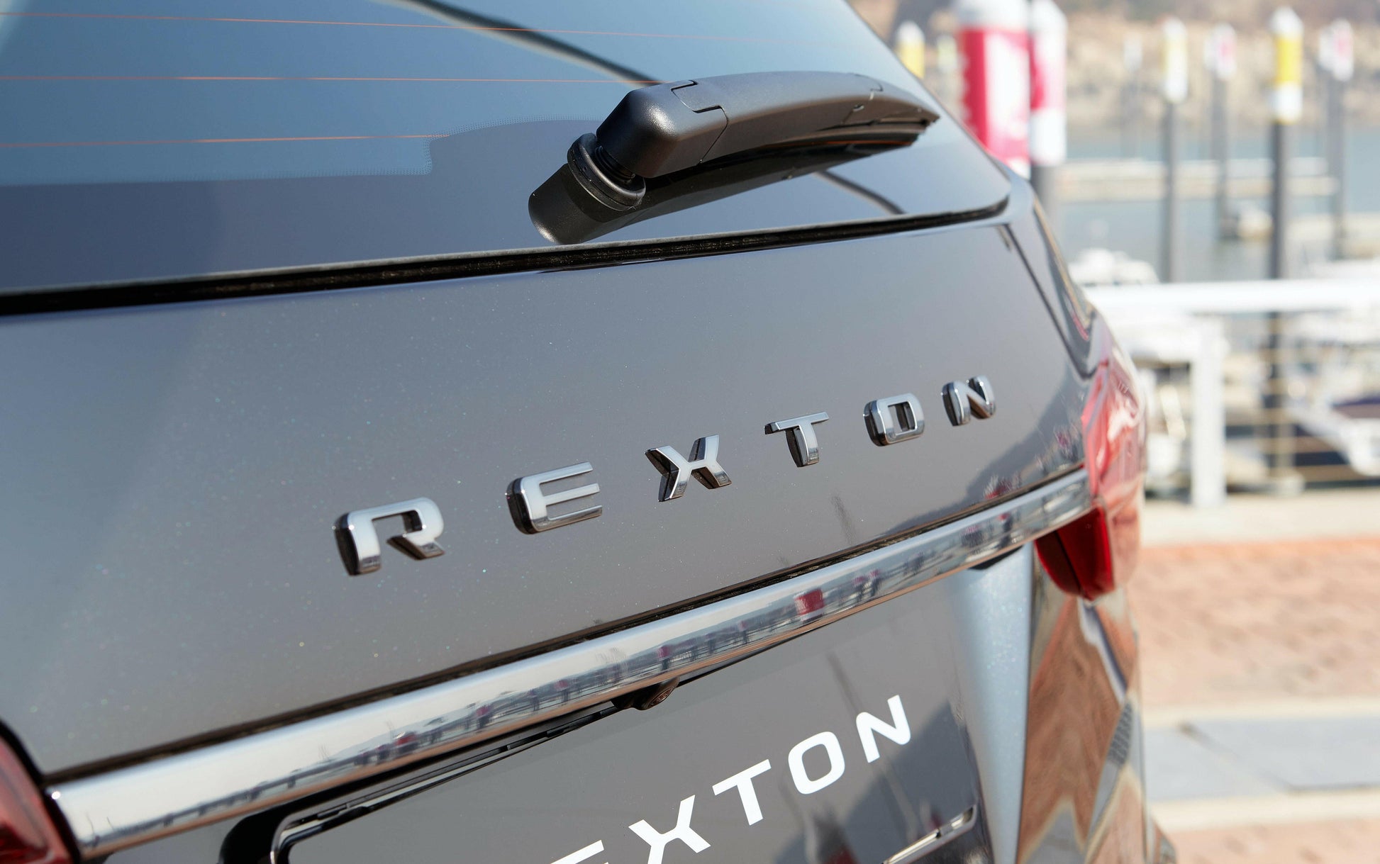 Genuine Ssangyong Rear 'REXTON' Badge (Black Edition).