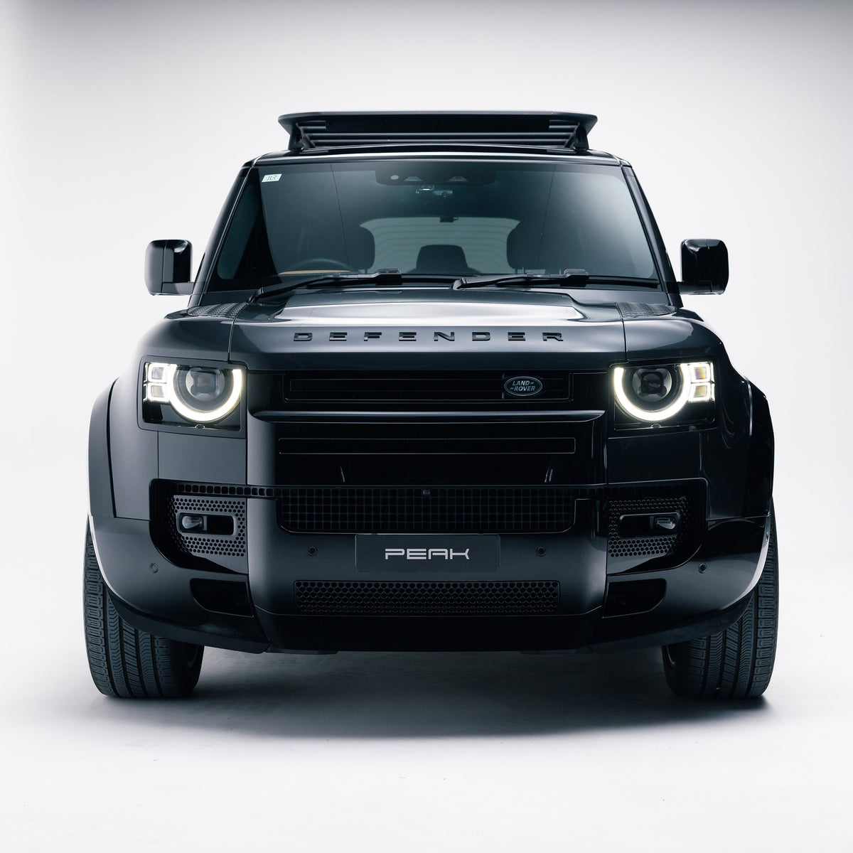 Land Rover Defender 110 with Gloss Black Exterior Styling Pack, front view