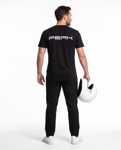 Back view of the PEAK Tee in Black showing the wordmark back print