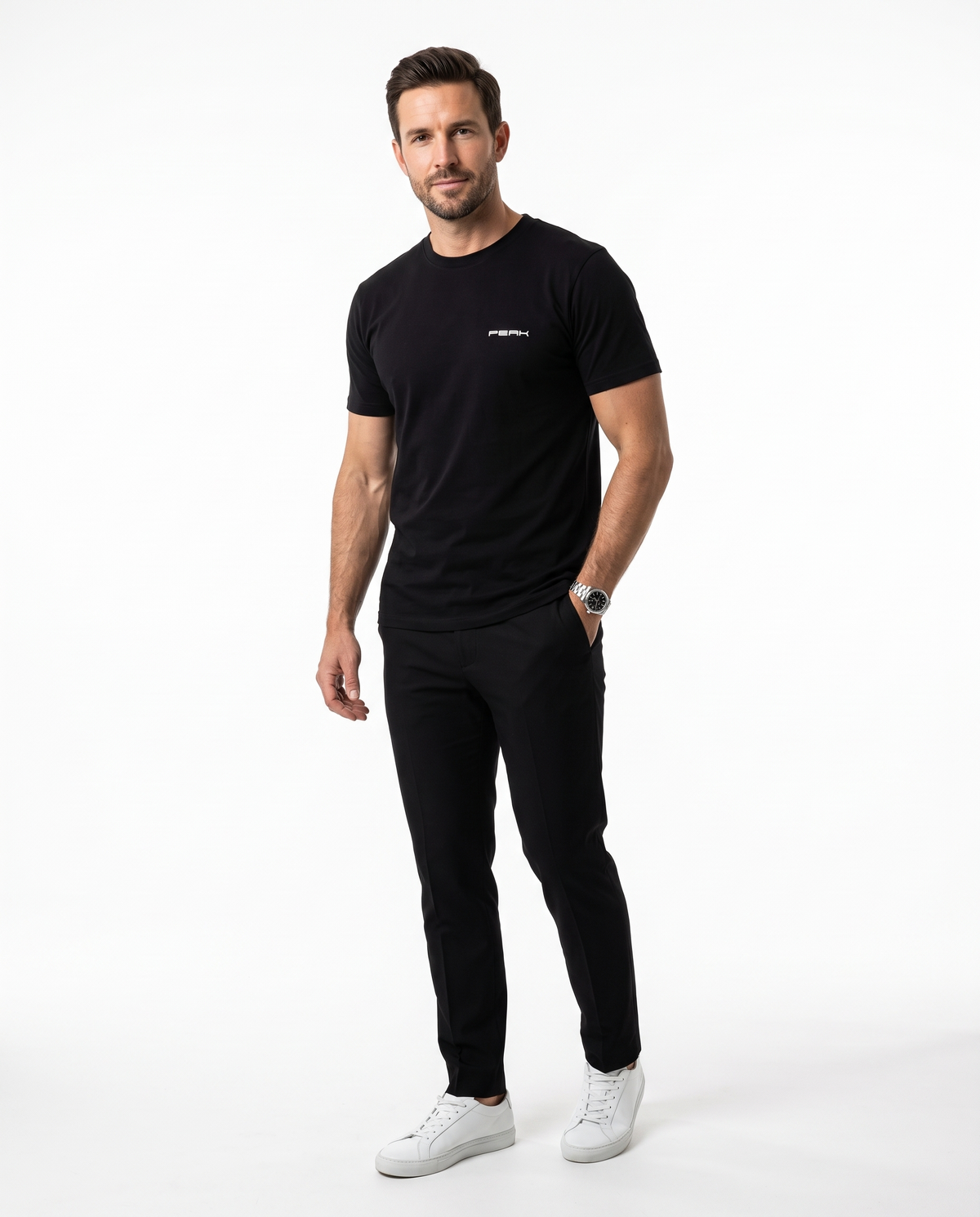 Man wearing the PEAK Tee, Chest & Spine Print in Black with a small left chest mark