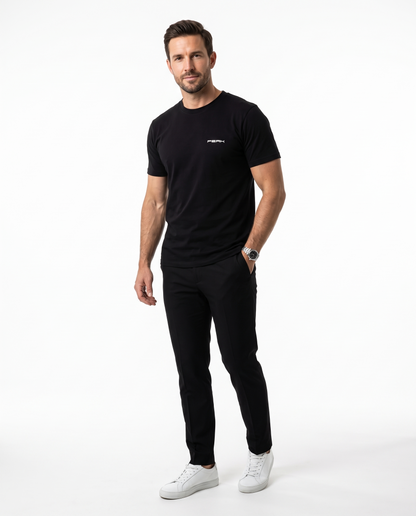 Man wearing the PEAK Tee, Chest & Spine Print in Black with a small left chest mark
